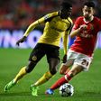 Dortmund's forward Ousmane Dembele (L) vies with Benfica's midfielder Pizzi Fernandes during the UEFA Champions League round of 16 first leg football match SL Benfica vs Borussia Dortmund at the Luz stadium in Lisbon on February 14, 2017