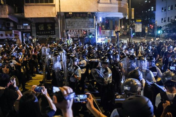 The November protest outside China's liaison office in Hong Kong saw scuffles as demonstrators charged barriers and police used pepper spray to drive them back