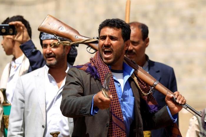 Fighters loyal to the Huthi movement protest in the capital Sanaa against airstrikes by the Saudi-led coalition in the Yemeni province of Hajjah