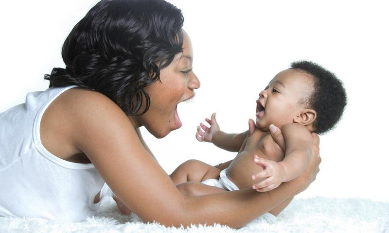 Mom playing with baby(The Fertile Chick)