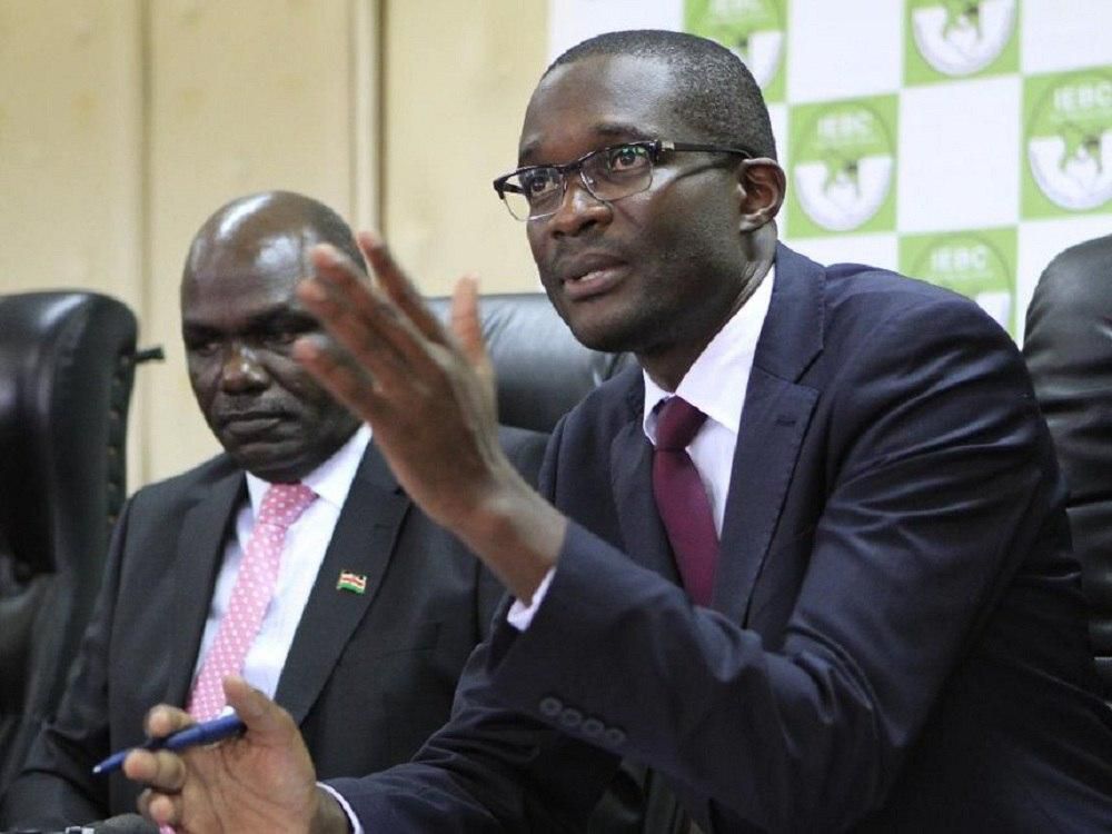 IEBC chairman Wafula Chebukati and Ezra Chiloba