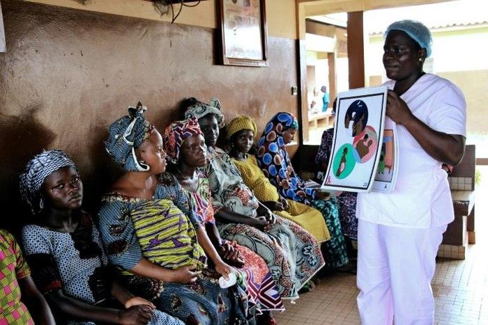 Blandine Mekpo, a midwife at a maternity ward, provides information about AIDS to pregnant women in Bohicon, southern Benin