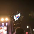 Human rights activists in South Korea, whose flag is displayed on a smartphone screen in this photo, say cases of sexual violence within the military occur persistently despite government efforts to curb them