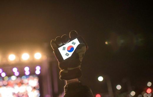 Human rights activists in South Korea, whose flag is displayed on a smartphone screen in this photo, say cases of sexual violence within the military occur persistently despite government efforts to curb them