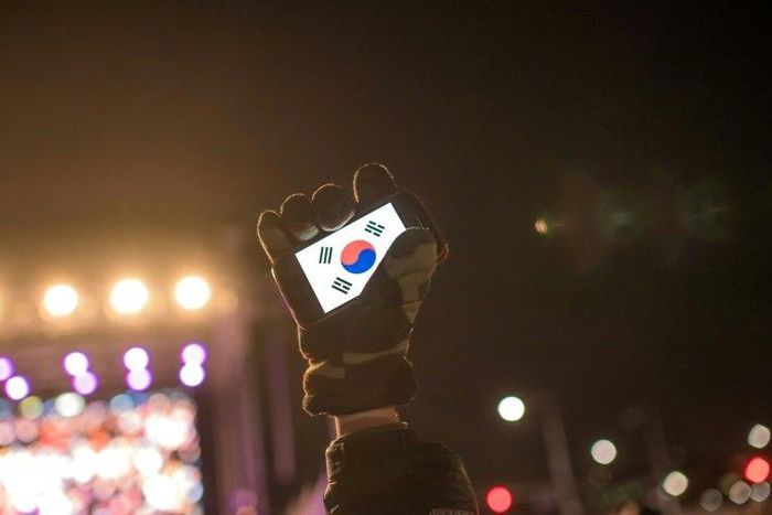 Human rights activists in South Korea, whose flag is displayed on a smartphone screen in this photo, say cases of sexual violence within the military occur persistently despite government efforts to curb them
