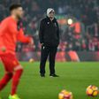 Liverpool's manager Jurgen Klopp watches his players as they warm up ahead of the English Premier League match between against Chelsea, at Anfield in Liverpool, on January 31, 2017