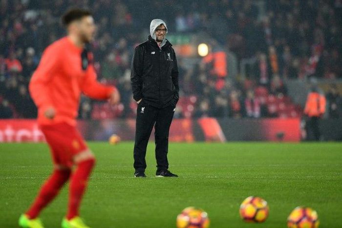Liverpool's manager Jurgen Klopp watches his players as they warm up ahead of the English Premier League match between against Chelsea, at Anfield in Liverpool, on January 31, 2017