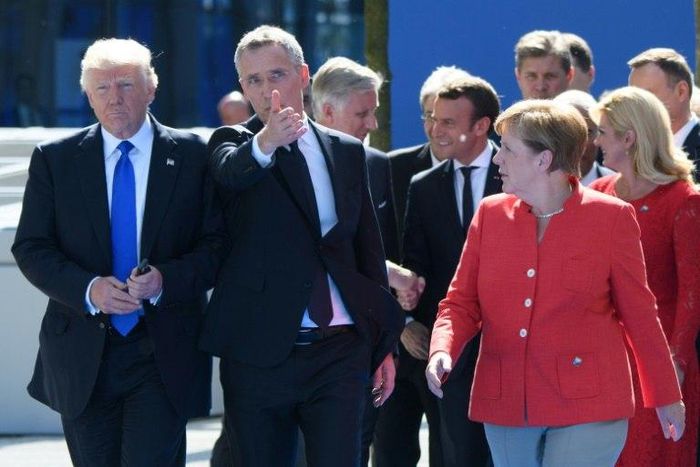 President Donald Trump, shown with NATO Secretary General Jens Stoltenberg (C) and German Chancellor Angela Merkel, has hit out at Germany over its car sales in the US, according to Der Spiegel