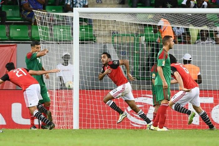 Egypt's midfielder Mahmoud Kahraba (C) celebrates with teammates after scoring a goal during the 2017 Africa Cup of Nations quarter-final football match between Egypt and Morocco in Port-Gentil on January 29, 2017