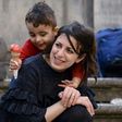 Syrians Nour and her son Riad are among the 12 refugees taken in by Pope Francis from a refugee camp a year ago