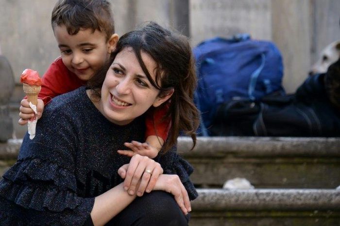 Syrians Nour and her son Riad are among the 12 refugees taken in by Pope Francis from a refugee camp a year ago
