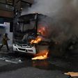 Civil servants protesting against austerity measures clash with riot police and set fire to a bus on Rio Branco, the main avenue in Rio de Janeiro, Brazil, while firefighters attempt to put out the blaze, on February 1, 2017