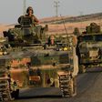 Turkish soldiers drive back to Turkey from the Syrian-Turkish border town of Jarabulus in September 2016