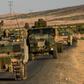 Turkish soldiers drive back to Turkey from the Syrian-Turkish border town of Jarabulus in September 2016