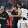 Chelsea's head coach Antonio Conte (L) embraces Chelsea's striker Diego Costa (R) at the end of the English Premier League football match between Bournemouth and Chelsea at the Vitality Stadium in Bournemouth, southern England on April 8, 2017