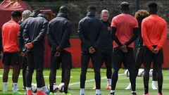 Manchester United players observe a minute's silence for the victims of yesterday's terror attack at the Manchester Arena, during a training session at the club's training complex near Carrington, on May 23, 2017