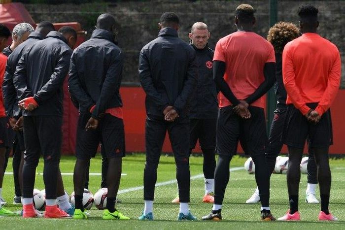 Manchester United players observe a minute's silence for the victims of yesterday's terror attack at the Manchester Arena, during a training session at the club's training complex near Carrington, on May 23, 2017
