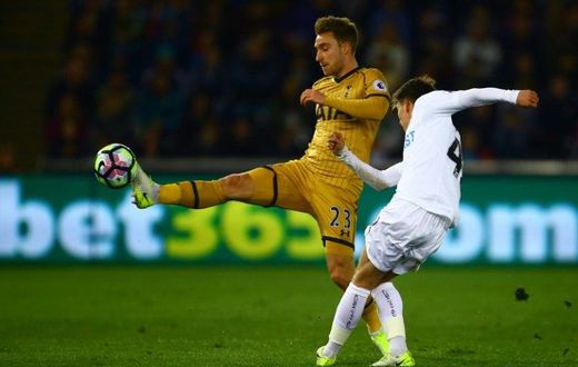 Tottenham Hotspur's midfielder Christian Eriksen (L) vies with Swansea City's English midfielder Tom Carroll during the English Premier League football match between Swansea City and Tottenham Hotspur at The Liberty Stadium on April 5, 2017
