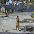 Pakistani security officials examine the site of a bomb attack in blast site in an upscale suburb of Lahore, on February 23, 2017