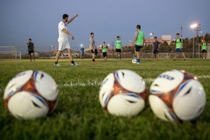 Israeli youth players from the Aroni Ariel football club attend a training session at their stadium in the Israeli West Bank settlement of Ariel on September 21, 2016