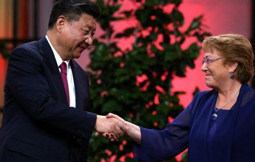 The two countries agreed on trade the move during a visit by Chinese President Xi Jinping (L) to Chile last year, where he is seen with Chilean President Michelle Bachelet (R)