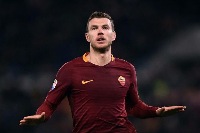 Roma's forward from Bosnia-Herzegovina Edin Dzeko celebrates after scoring during the Italian Serie A football match Roma vs Fiorentina at the Olympic Stadium in Rome on February 7, 2017
