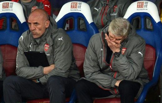 Arsenal fans subjected manager Arsene Wenger (R) to a stream of abuse and calls to resign as the team lost to Crystal Palace