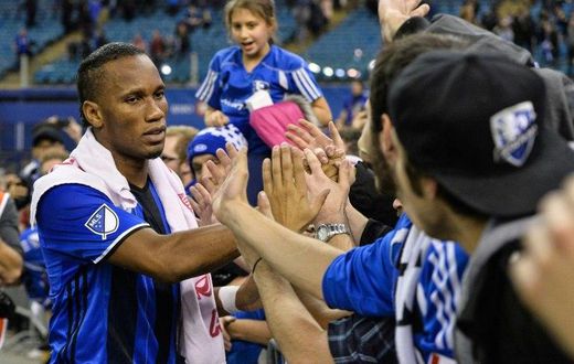 Didier Drogba of the Montreal Impact celebrates with fans during leg one of the MLS Eastern Conference finals against the Toronto FC at Olympic Stadium on November 22, 2016