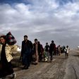 Displaced residents of western Mosul evacuate the area on March 14, 2017