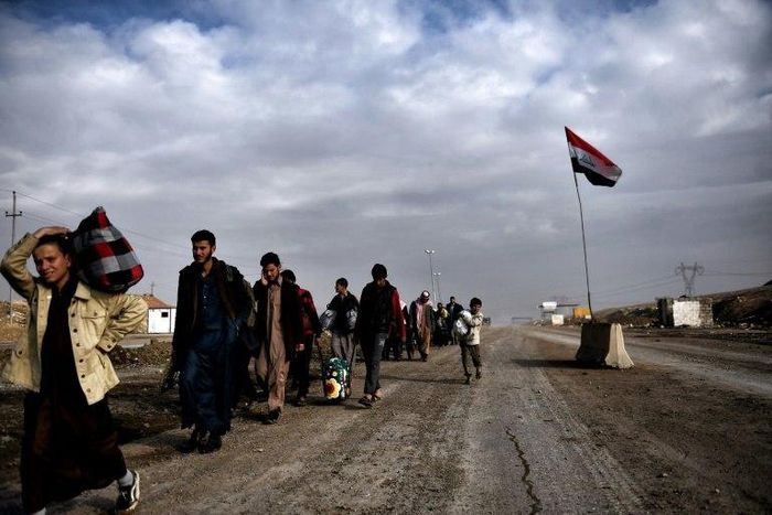 Displaced residents of western Mosul evacuate the area on March 14, 2017