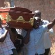 People carrying a coffin