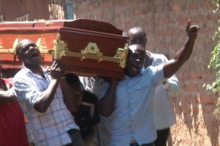 People carrying a coffin