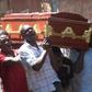 People carrying a coffin