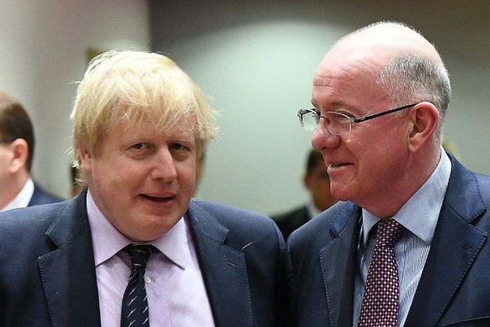 UK Foreign Secretary Boris Johnson (L) and Ireland's Foreign Minister Charlie Flanagan arrive to attend a foreign affair council at the European Council in Brussels, on March 6, 2017