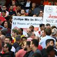 Fans hold up banners calling for a managerial change at Arsenal on May 21, 2017