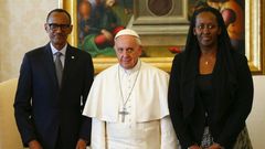 Pope Francis (centre) poses with Rwanda's President Paul Kagame and his wife Jeannette Kagame ahead of a meeting at the Vatican March 20, 2017