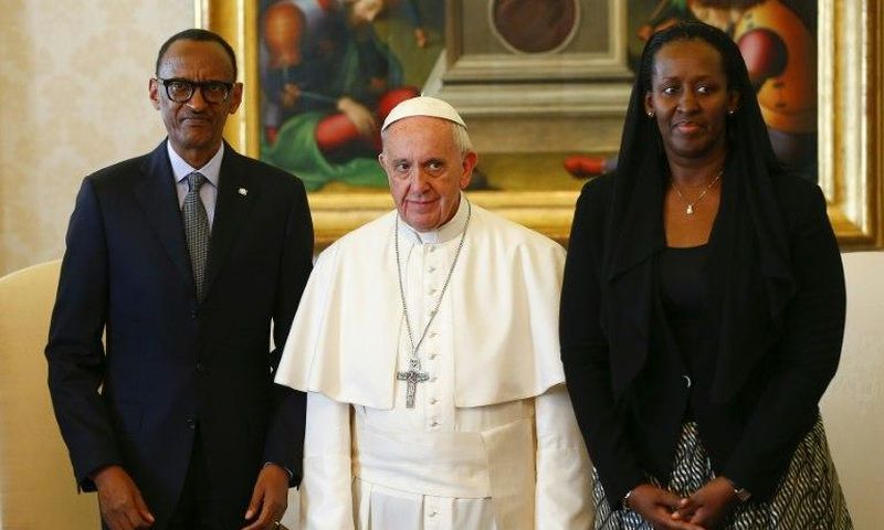 Pope Francis (centre) poses with Rwanda's President Paul Kagame and his wife Jeannette Kagame ahead of a meeting at the Vatican March 20, 2017