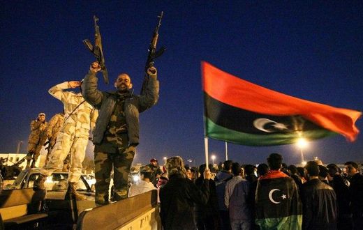 A photo by AFP photographer Abdullah Doma shows Libyans celebrating the sixth anniversary of the Libyan revolution in Benghazi on February 17, 2017