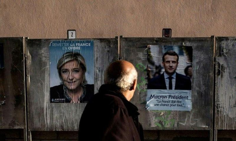 French presidential candidates Emmanuel Macron and Marine Le Pen are at odds on many issues