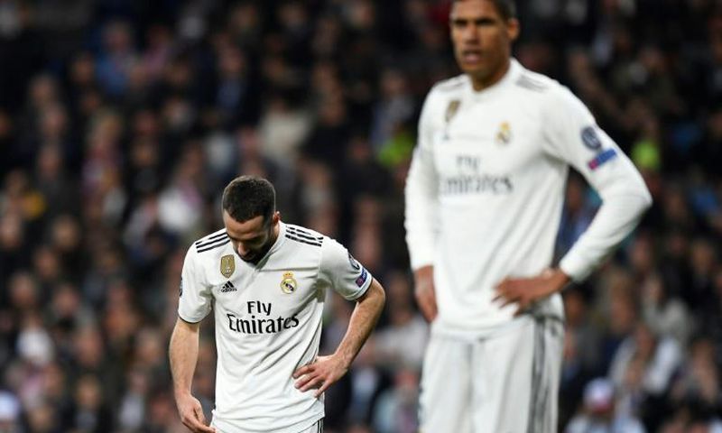 A dejected Dani Carvajal (L) comes to terms with Real Madrid's humiliating Champions League exit