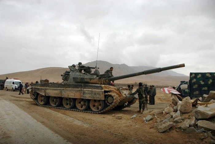 Syrian regime fighters take position as they advance to retake the ancient city of Palmyra, from Islamic State (IS) group fighters on March 2, 2017