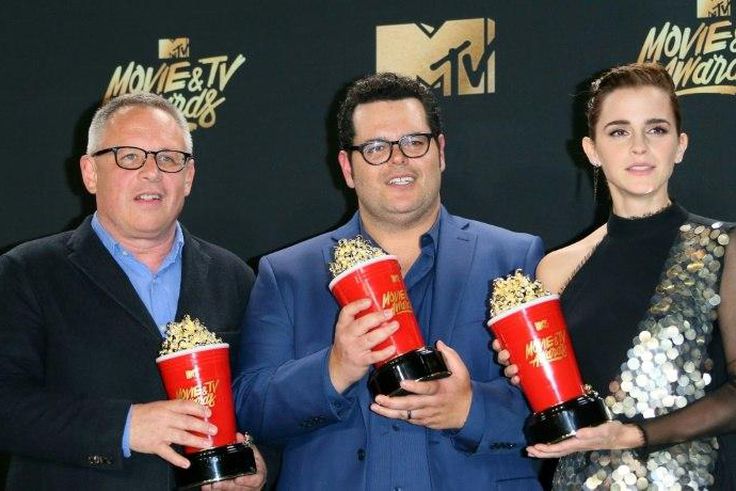 Director Bill Condon (L) and actors Josh Gad (C) and Emma Watson (R), winners of Movie of the Year for 'Beauty and the Beast' at the MTV Movie & TV Awards