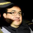 Javier Duarte (C), former governor of the Mexican state of Veracruz, in a police patrol car following his arrest upon his arrival at the Matamoros military barracks in Guatemala City on April 16, 2017