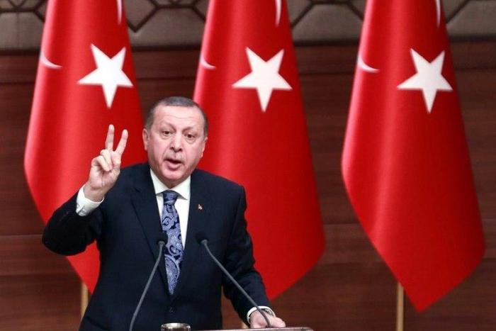 Turkish President Recep Tayyip Erdogan delivers a speech at the Presidential complex in Ankara, on January 19, 2017