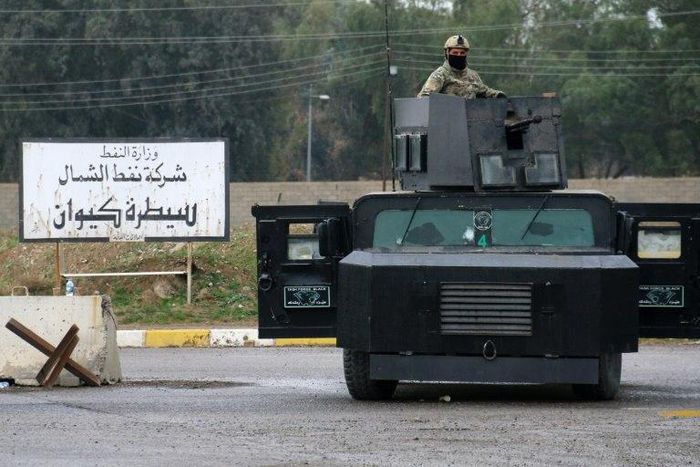 Masked Kurdish forces loyal to the Patriotic Union of Kurdistan (PUK) stand guard at the North Oil Company headquarters in the northern Kurdish-controlled city of Kirkuk on March 2, 2017