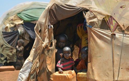 Internally displaced children pictured at the entrance of a hut at a makeshift camp on the outskirts of Baidoa, in the southwestern Bay region of Somalia, on March 14, 2017