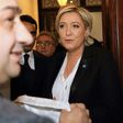 France's far-right presidential candidate Marine Le Pen rejects a headscarf ahead of her meeting with Lebanon's Grand Mufti Sheikh Abdullatif Deryan in Beirut on February 21, 2017