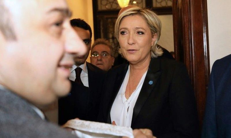 France's far-right presidential candidate Marine Le Pen rejects a headscarf ahead of her meeting with Lebanon's Grand Mufti Sheikh Abdullatif Deryan in Beirut on February 21, 2017