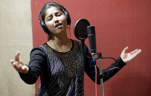 Indian singer Ginni Mahi sings songs set against Punjabi dance beats, exhorting pride in her Dalit roots
