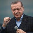 Turkish President Recep Tayyip Erdogan gestures as he delivers a speech on April 8, 2017 during a campaign rally for the "yes" vote in a constitutional referendum in Istanbul